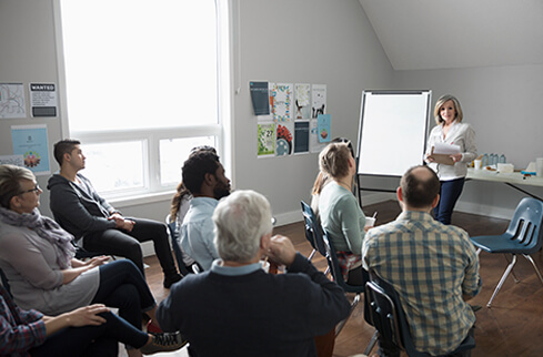 Woman presenting in front of class